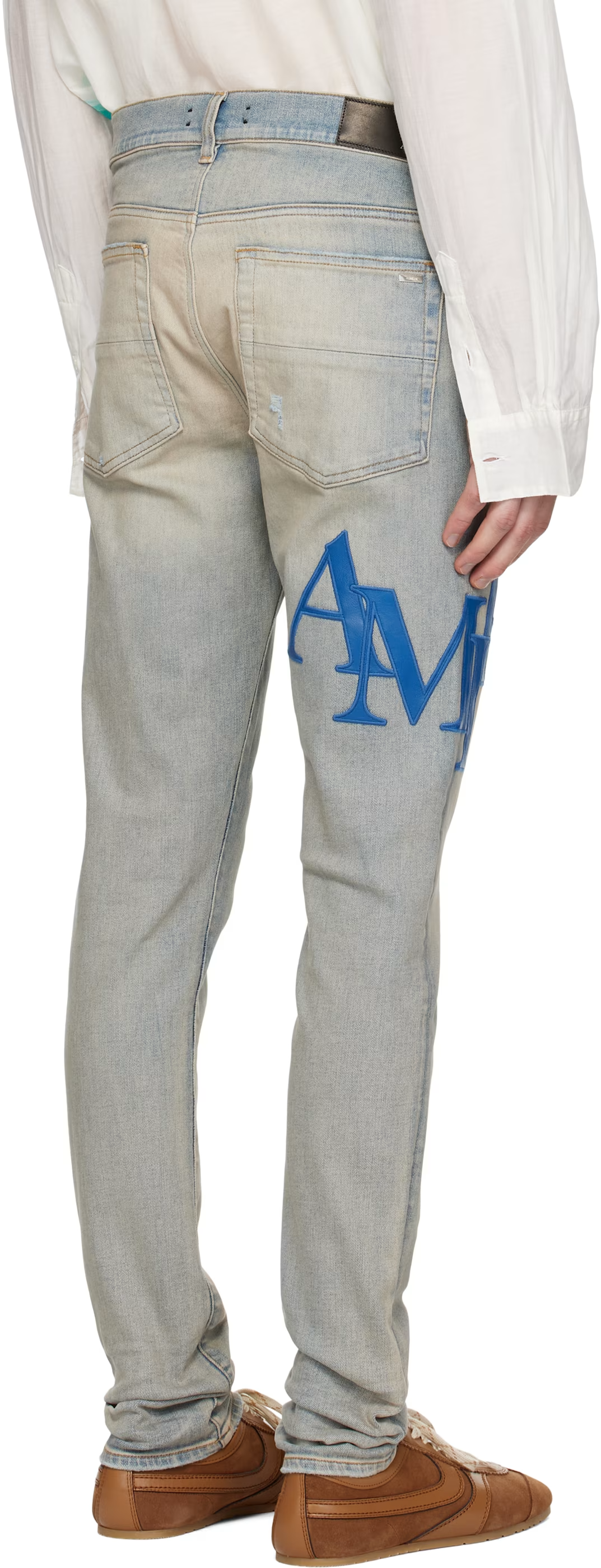 AMIRI STAGGARED LOGO JEANS
