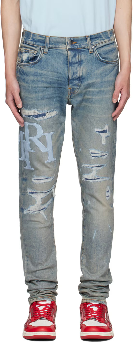 AMIRI STAGERED LOGO JEANS-blue