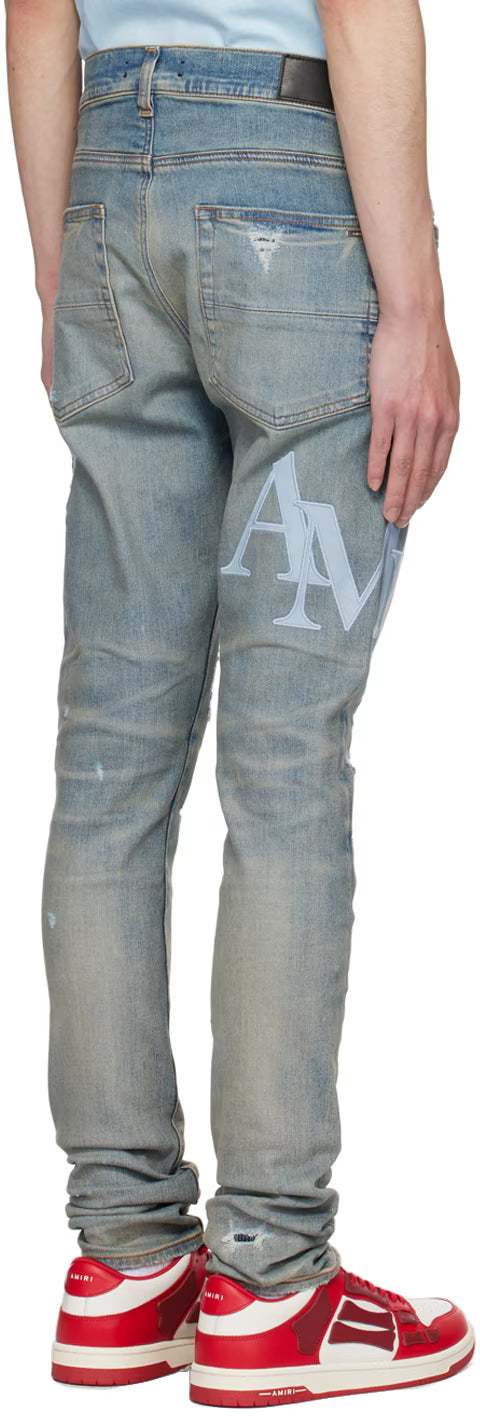 AMIRI STAGERED LOGO JEANS-blue
